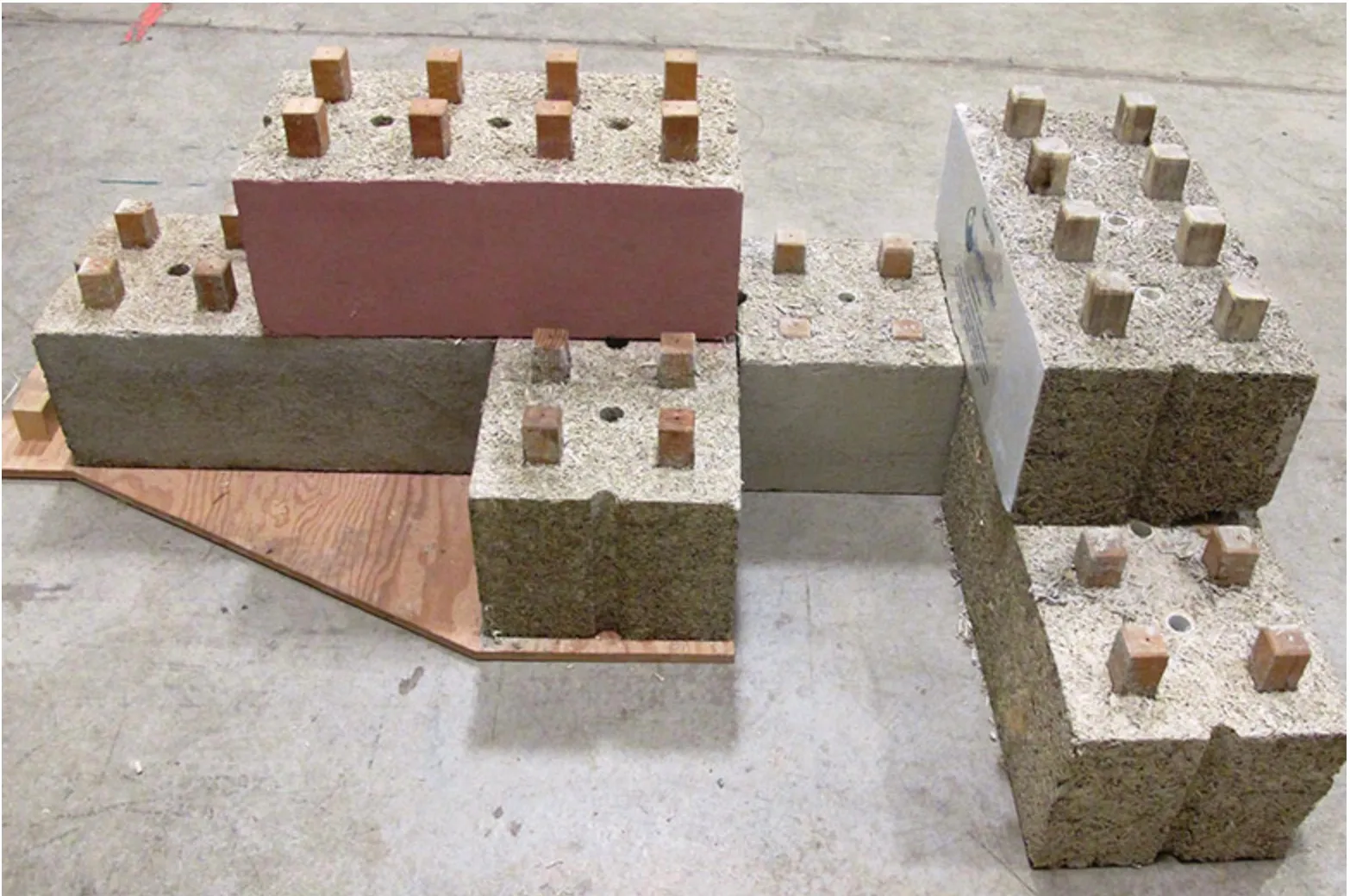 Hempcrete building blocks stacked on a workshop floor